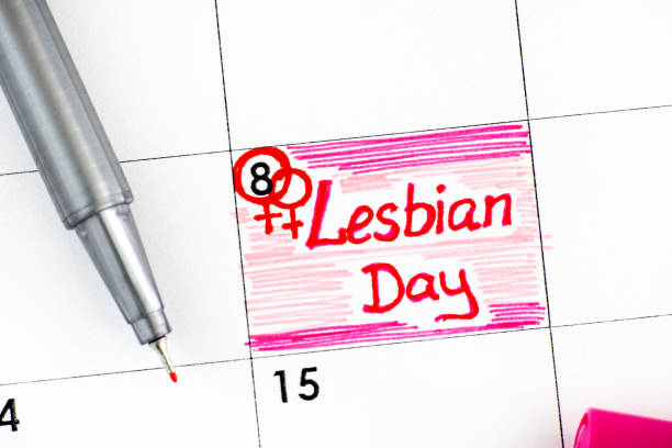 istock Reminder Lesbian Day in calendar with pen. October 08. 1265594559