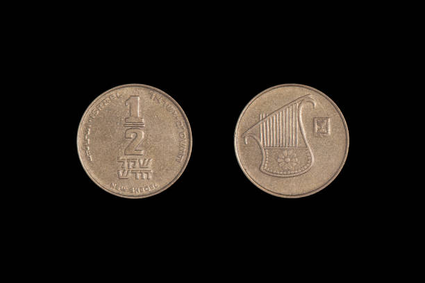 istock half Israeli new sheqel from both sides on a black background. Close-up 1265599179