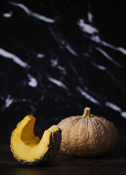 istock Fresh yellow Pumpkin over rustic wooden table. 1265602730