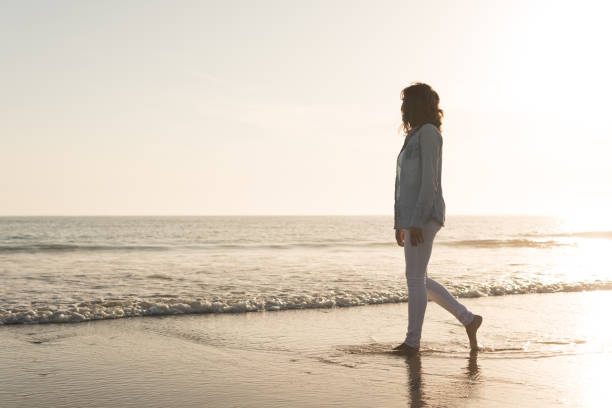 istock Woman at the beach 1265602845