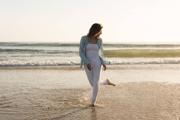 istock Woman at the beach 1265602873