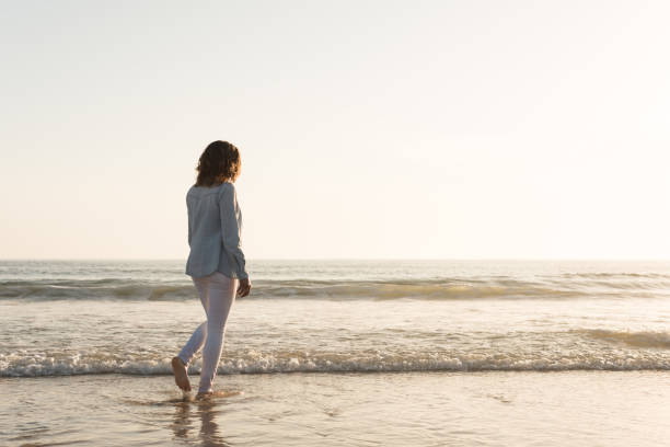 istock Woman at the beach 1265603000