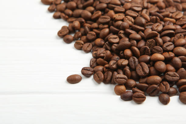 istock coffee beans on a colored background. Place to insert text, minimalism 1265604500