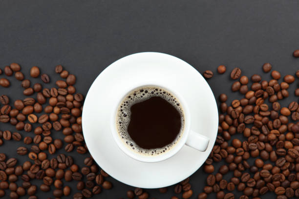 istock coffee beans and coffee cup on colored background with place for text 1265605284
