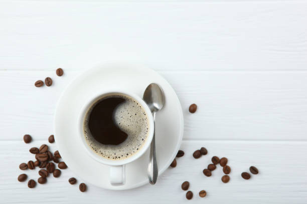 istock coffee beans and coffee cup on colored background with place for text 1265606986