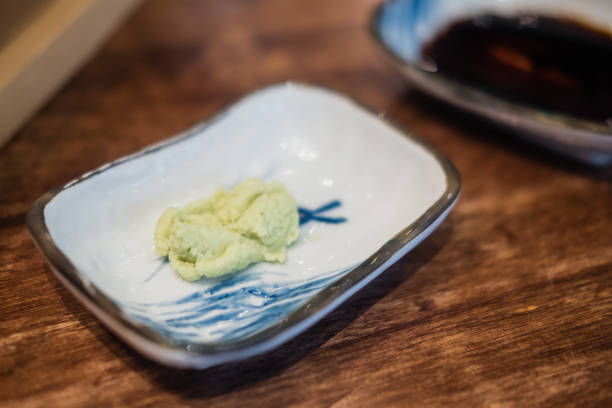 istock Green wasabi sauce in mini bowl. Selective focus 1265607001