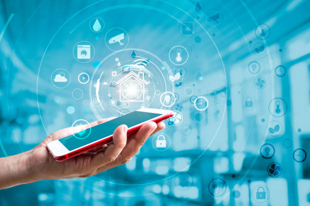 istock Using smart home application on mobile phone with showing virtual screen and icons. House control and Automation system technology of things 1265607727