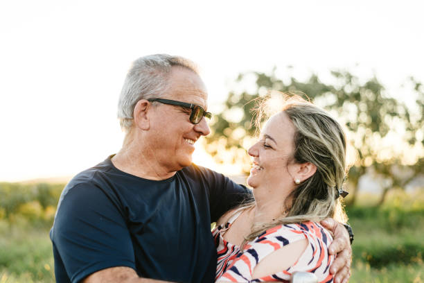 istock Father and daughter smiling face to face at sunset 1265607740