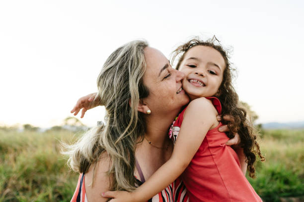 istock Mother and daughter hugging in the countryside 1265608007