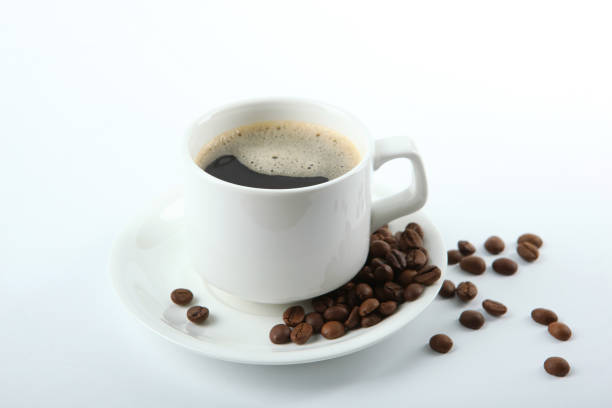 istock coffee beans and coffee cup on colored background with place for text 1265608207