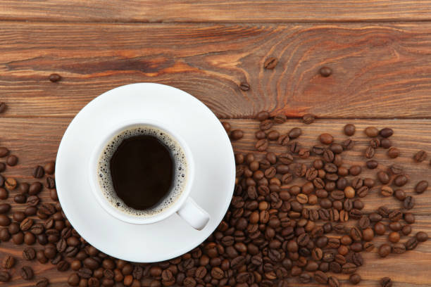istock coffee beans and coffee cup on colored background with place for text 1265608222