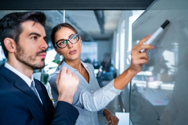 istock Business colleagues discussing ideas in office. 1265609356