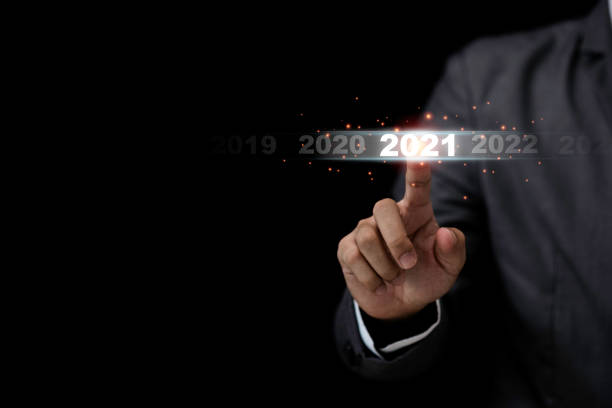 Businessman touching 2021 year for starting new year and new business startup concept. Businessman touching 2021 year for starting new year and new business startup concept. january photos stock pictures, royalty-free photos & images