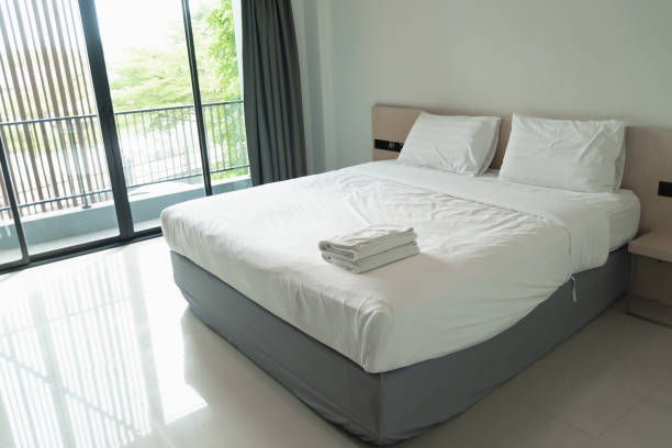 istock interior modern  bedroom white bed in the hotel 1265612547