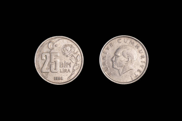 istock Turkish 25 Bin Liras Coins Isolated On black. close-up. 1265620160