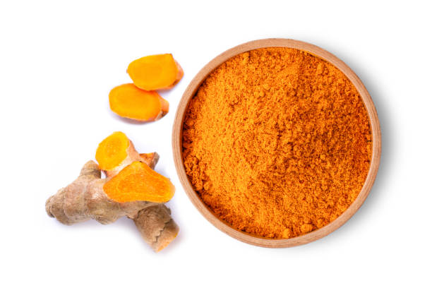 Turmeric Turmeric ( curcumin, Curcuma longa Linn) powder in wooden bowl with rhizome and sliced isolated on white background. Top view. Flat lay.Copy space for text. kourion stock pictures, royalty-free photos & images
