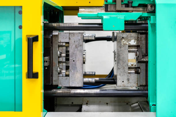 istock metal mould or plastic injection mold setup on high pressure injection molding machine for mass production or manufacturing in industrial 1265626849