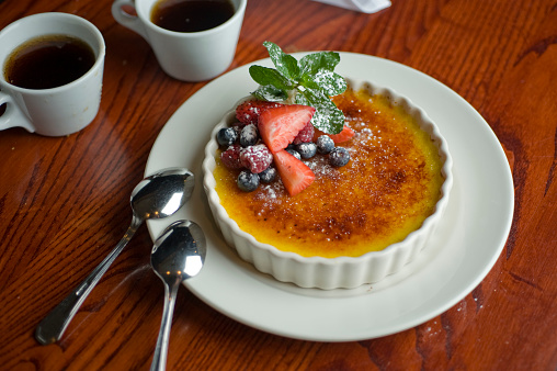 Crème brulee. Desserts. Classic American or French bakeries or pastry shop favorites. Cookies, whipped cream, cakes, chocolate syrup butter, eggs and vanilla beans.