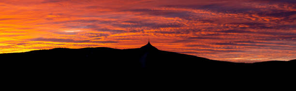istock Silhouette of Jested mountain at sunset time with beautyifully illuminated evening sky, Liberec, Czech Republic 1265629911
