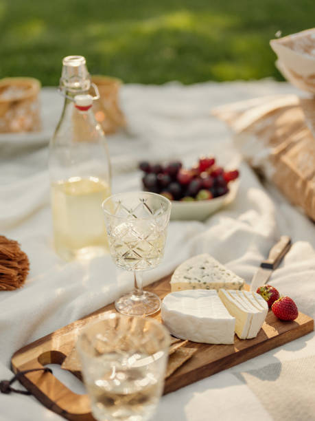 istock Wine and cheese picnic outdoors in summer 1265630314