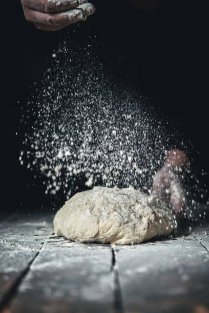 istock Kneading Loaf of Bread with Hands 1265630500