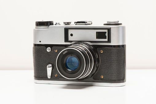 Retro photo camera. Front view isolated on white background