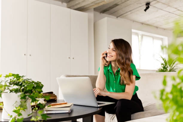 istock Young woman working on computer in the eco-friendly office 1265632708