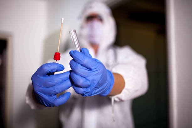 istock Doctor showing covid-19 tube test and sampling swab 1265633651