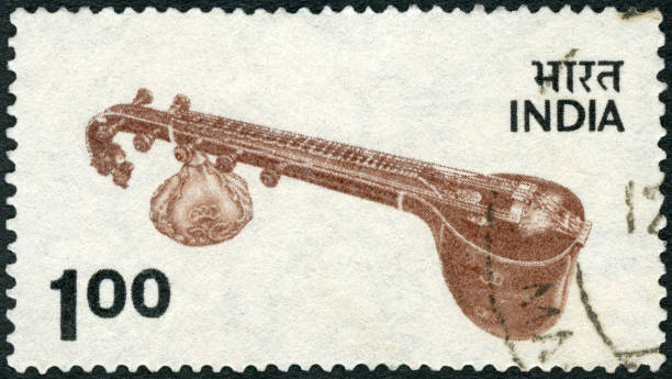istock Postage stamp printed in India shows Veena, 1974 1265634857