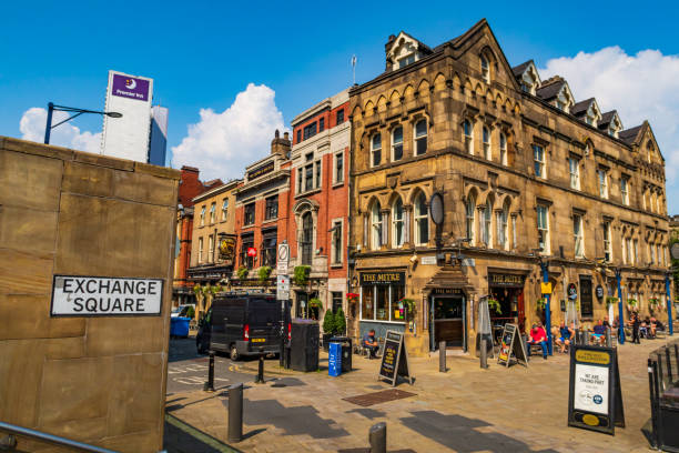 Manchester, United Kingdom - 12 August, 2020 :  People are walking on the Exchange square in Manchester, England