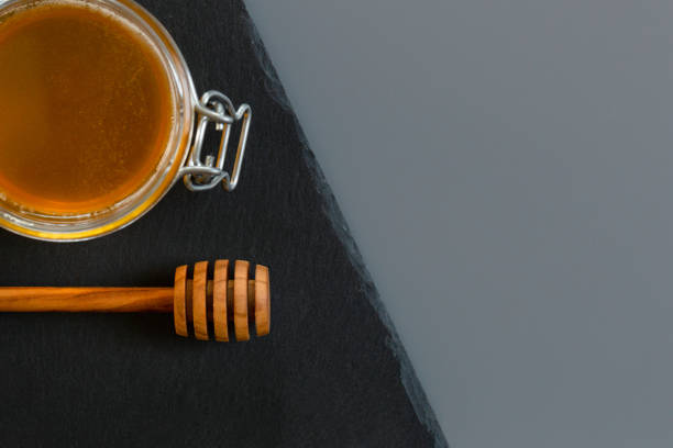 istock organic honey and rustic bread on a old wooden table. Healthy eating breakfast. 1265647671
