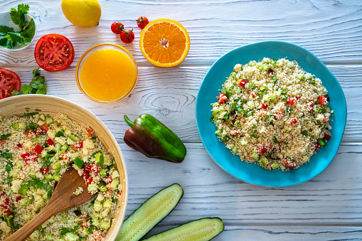 Tabbouleh salad recipe with tomato, cucumber, couscous pepper and citrus juice from middle eastern and Arabic dish, vegetarian vegan food