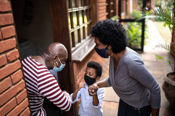 istock Grandmother and grandson using elbow greeting 1265649833
