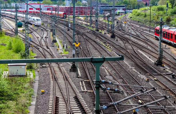 istock Multiple railroad tracks with junctions at a railway station in a perspective and birds view 1265652228