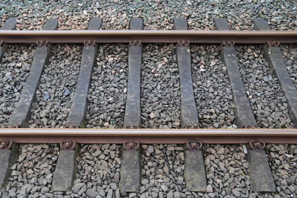 istock Multiple railroad tracks with junctions at a railway station in a perspective and birds view 1265655618