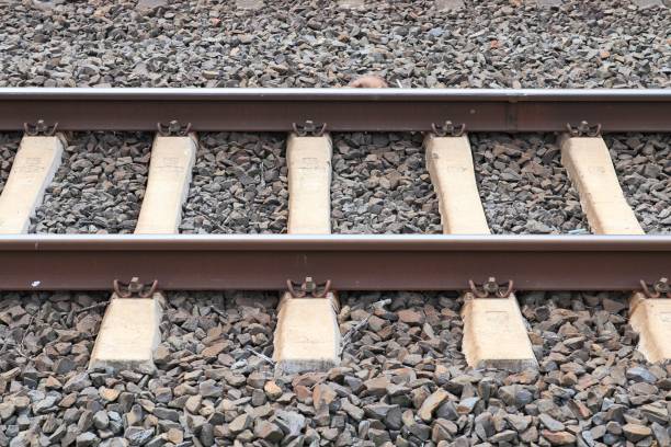 istock Multiple railroad tracks with junctions at a railway station in a perspective and birds view 1265655636