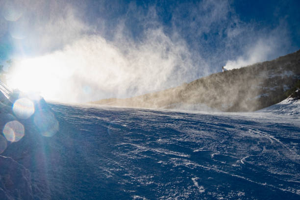 istock Heavy cloud of snow flakes bellow working snowcanon 1265655647