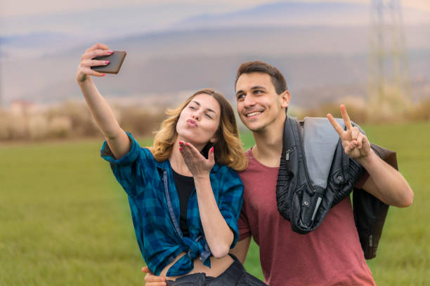 istock Couple walking in field and have fun. 1265656671