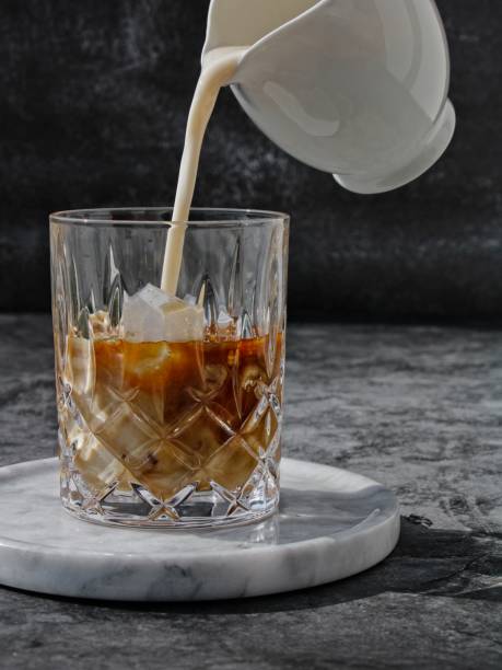 istock Pouring milk into the coffee 1265656978