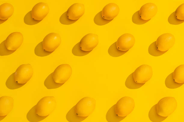 istock A Stylized Collection of Lemons on a Blue Background. 1265659676