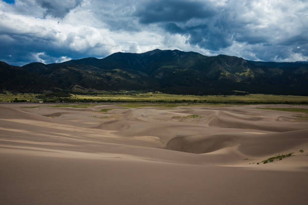 istock Sand Dunes and Mountains Landscape 1265660734