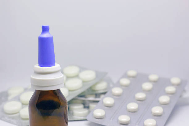istock nasal drops and pills on the table 1265660909
