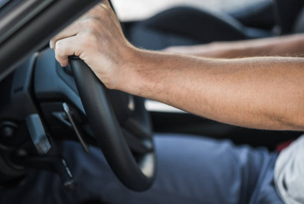 istock Drivers Hands on the Car Steering Wheel 1265663547
