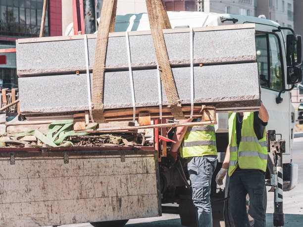 istock unloading concrete curbs. the installation of new curbs 1265664095