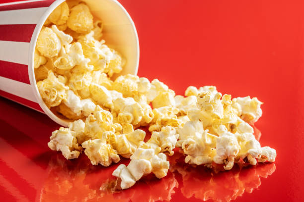 istock Sweet popcorn in striped paper cup. 1265671475