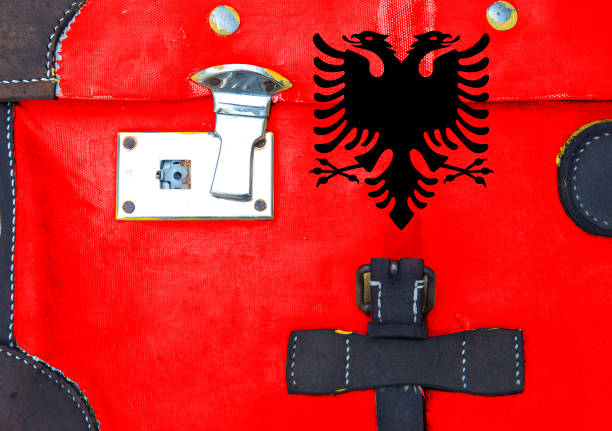 National Flag of Albania. The flag was adopted in 1912 when Albania gained independence from the Ottoman Empire.  The flag consists of a black double-headed eagle on a red background