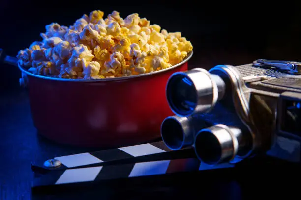 Movie theater popcorn with butter and blue backlighting