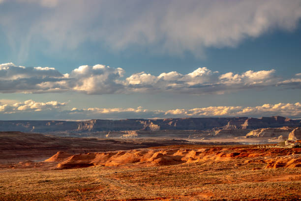 istock Rolling clouds and the evening sun shine gold on Page, AZ, USA 1265673845
