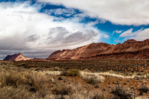 istock Dry grasslands and rugged mountains with thick clouds, AZ, USA 1265674247
