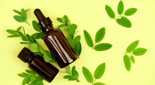 istock Natural organic cosmetics. Bottles with oils on a yellow background. 1265674461